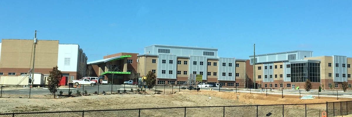 Construction site of a school building nearing the end of construction